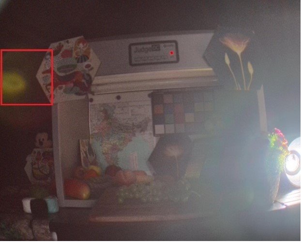 Lens flare reducing contrast and causing bright spots